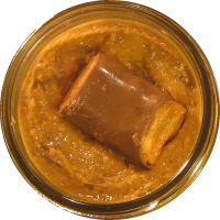 An image of homemade peanut butter with Butterfinger mixed in.