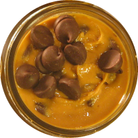 An image of homemade peanut butter with dark chocolate mixed in.