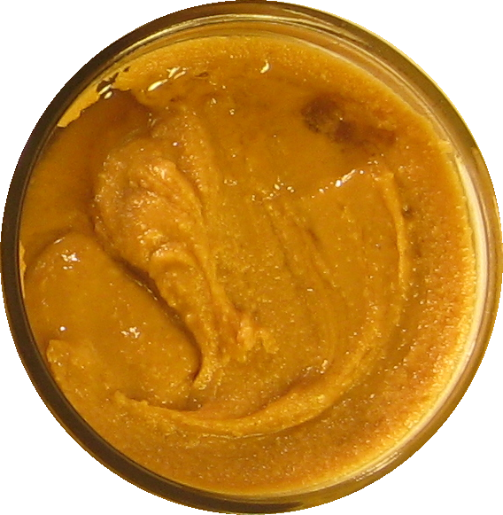 An image of homemade peanut butter with honey mixed in.