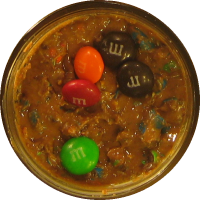 An image of homemade peanut butter with M&Ms mixed in.