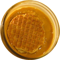 An image of homemade peanut butter with stroopwaffel mixed in.